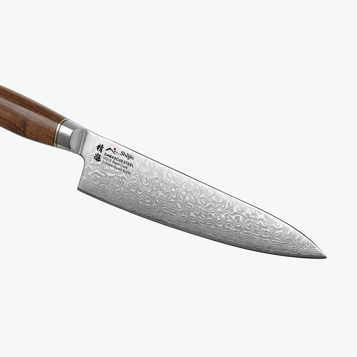 Damastmuster auf der Klinge des Shōjin Kaku Gyuto-Kochmessers mit Walnussgriff, Nahaufnahme